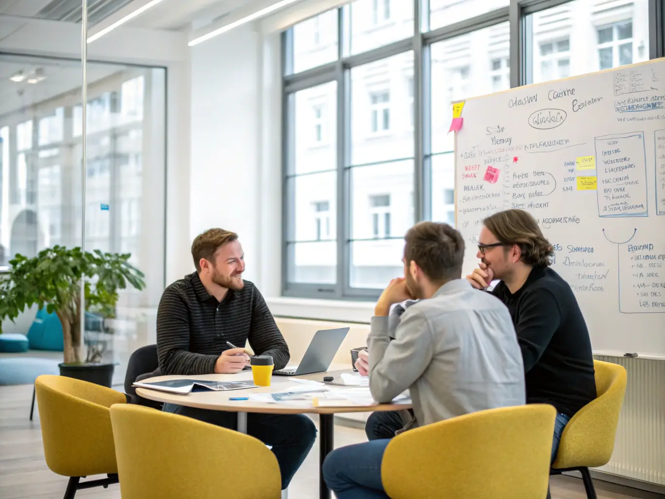 A team of consultants working on a strategic plan with healthcare startup founders, outlining growth strategies and operational setup.